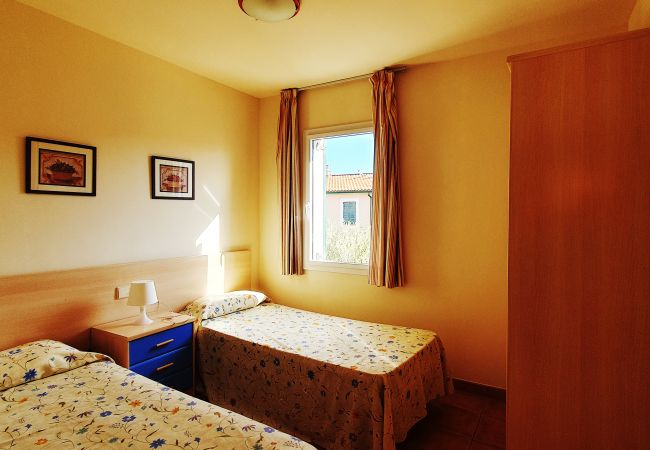 Bedroom with two single beds and wardrobe Bedroom with two single beds and wardrobe