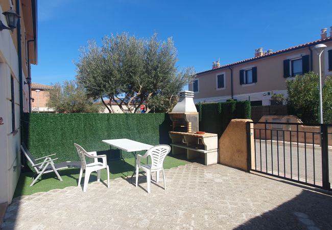 Front garden with barbecue and entrance to the garage Front garden with barbecue and entrance to the garage