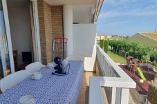 Terrace with table and chairs overlooking the communal area.