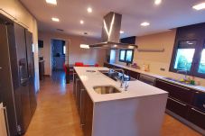 Kitchen with two gas burners, iron and ceramic hob